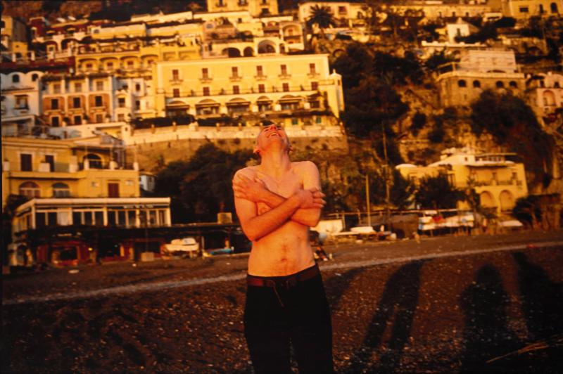 Pavel laughing on the beach, Positano, Italy