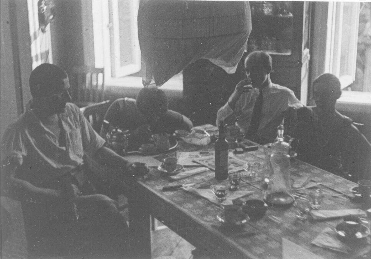 Vladimir Mayakovsky, Varvara Stepanova, Osip Beskin and Lily Brik at the Brik apartment, Gendrikov Pereulok, Moscow