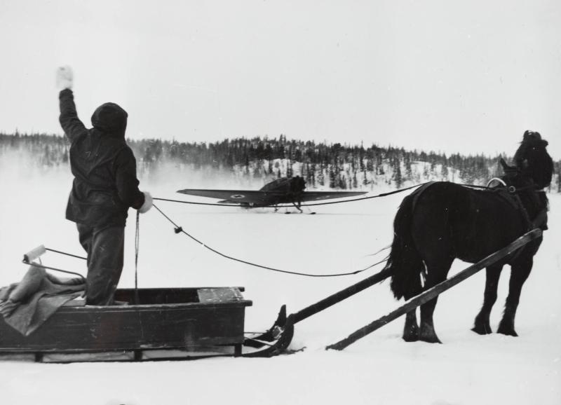 An ambulance plane landing on a lake in the wastes of Lapland