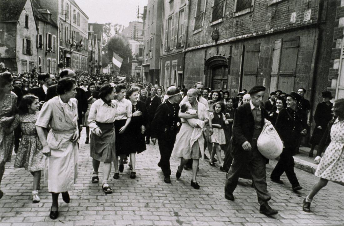Woman who Fraternised with the Germans is Punished by Having her Head Shaved. Chartres France, August 18, 1944