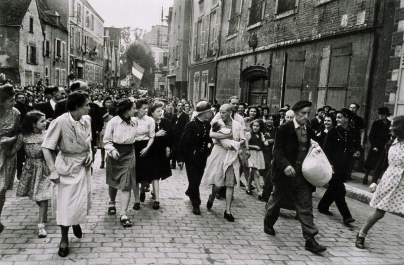 Woman who Fraternised with the Germans is Punished by Having her Head Shaved. Chartres France, August 18, 1944