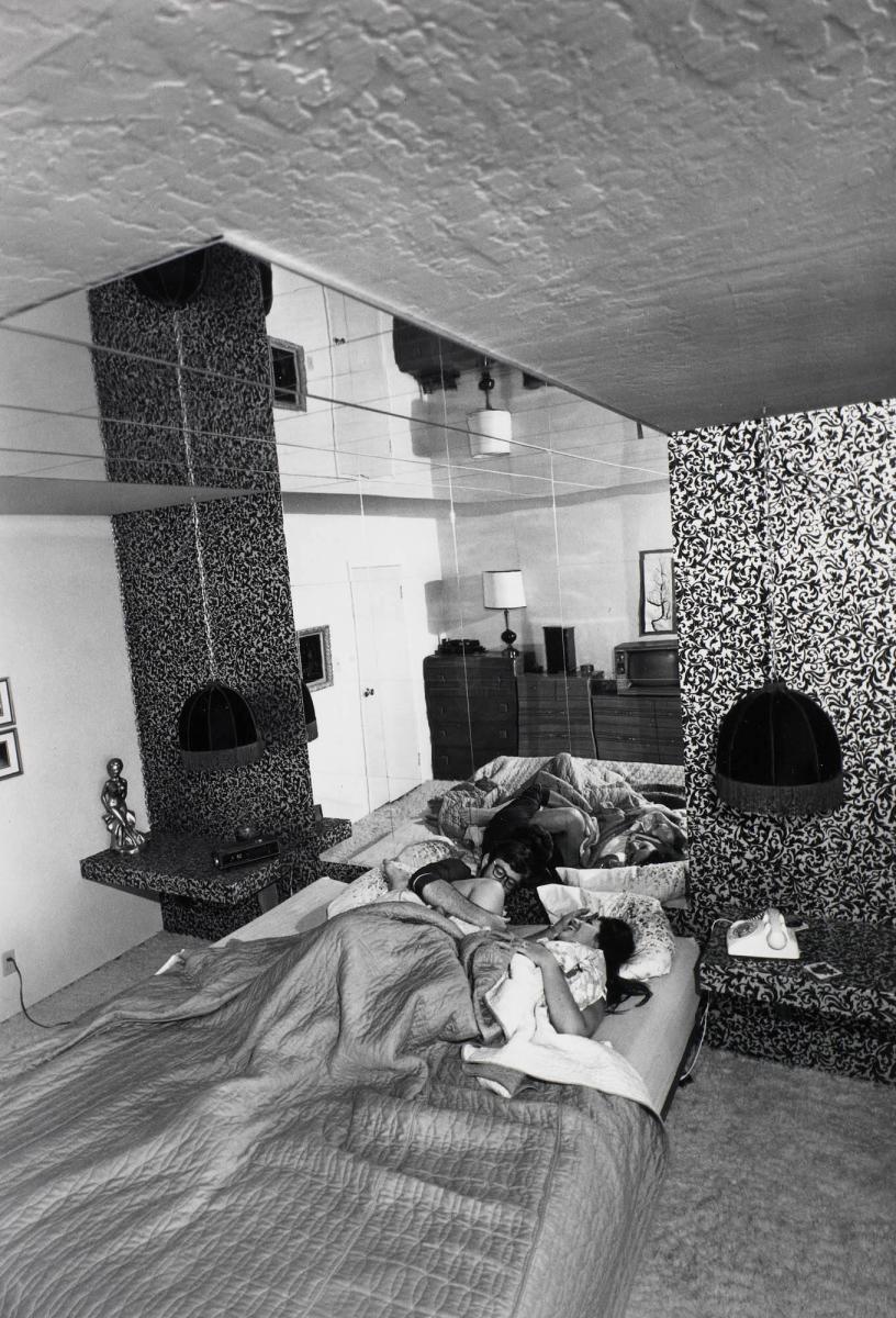 It's a great pleasure to watch yourself make love in the six dozen mirrors that line the ceilings and walls. I've spent a tremendous amount of thought and planning to get the total effect of the bedroom. From the series Suburbia