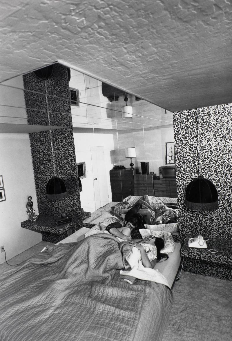 It's a great pleasure to watch yourself make love in the six dozen mirrors that line the ceilings and walls. I've spent a tremendous amount of thought and planning to get the total effect of the bedroom. From the series Suburbia