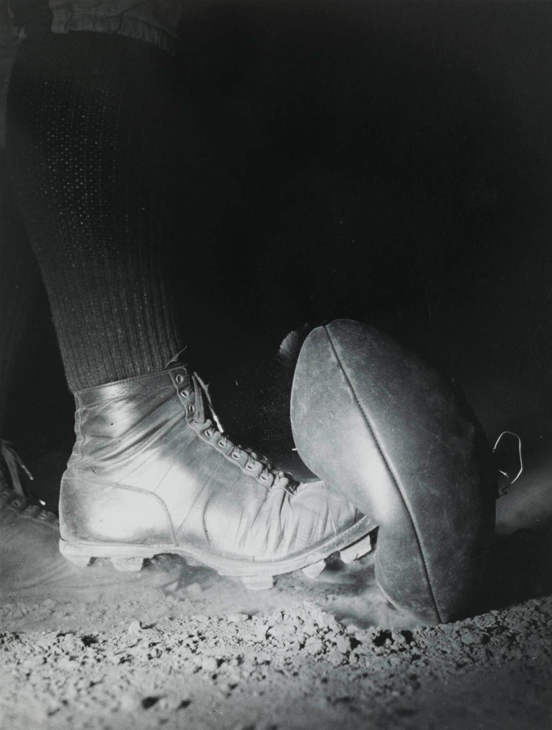 Football as it is being Kicked (Notice the Dust Suspended from the Top of the Ball)