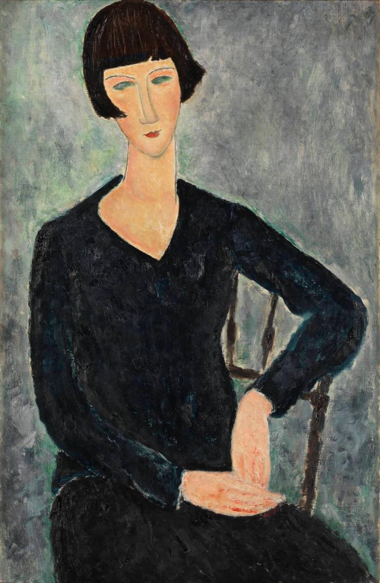 Femme assise à la robe bleue