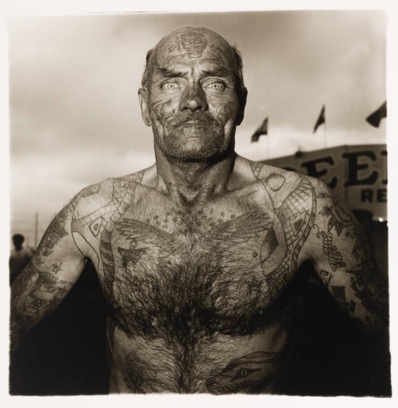 Tattooed man at a carnival, Maryland