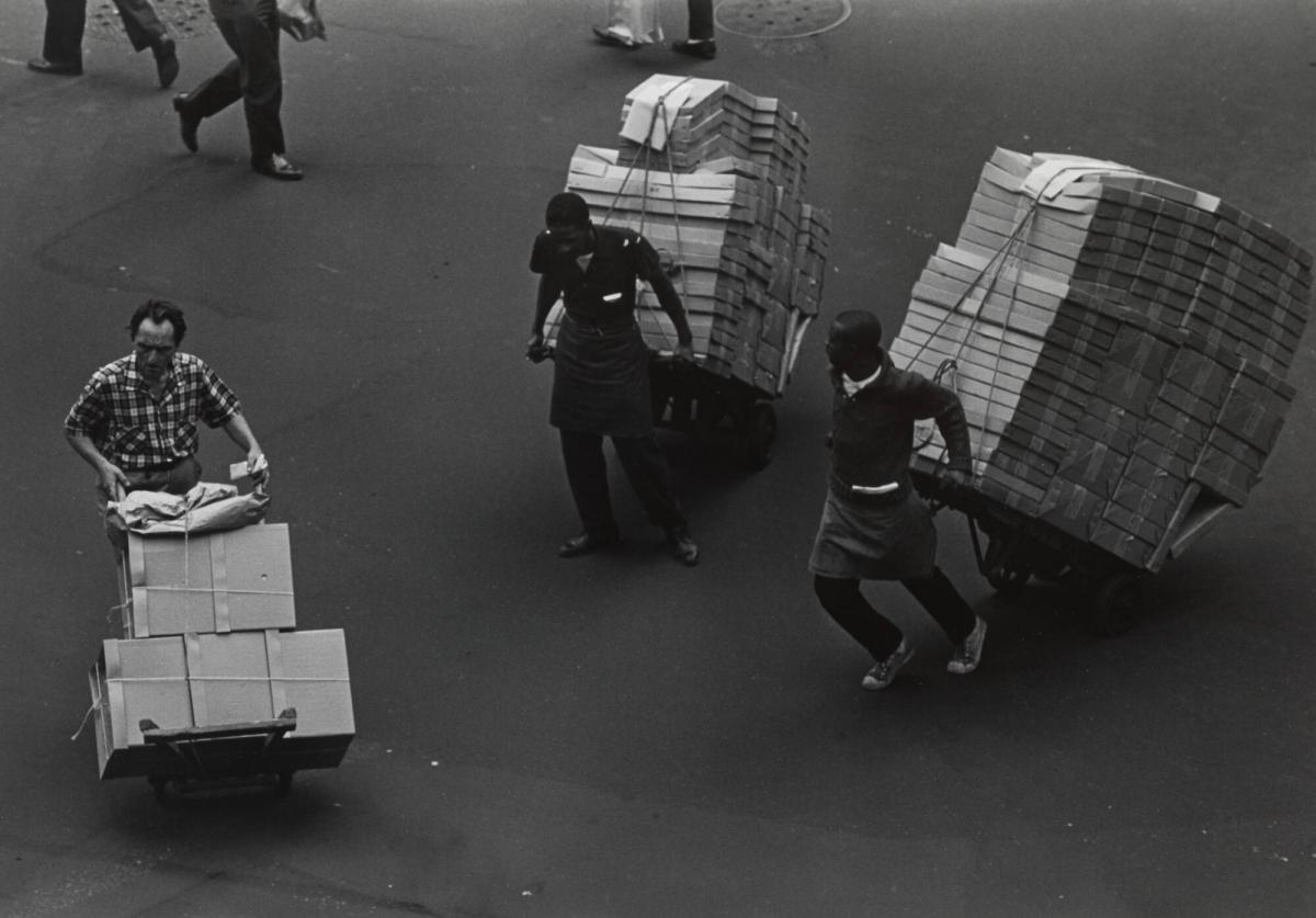 Three Men with Hand Trucks