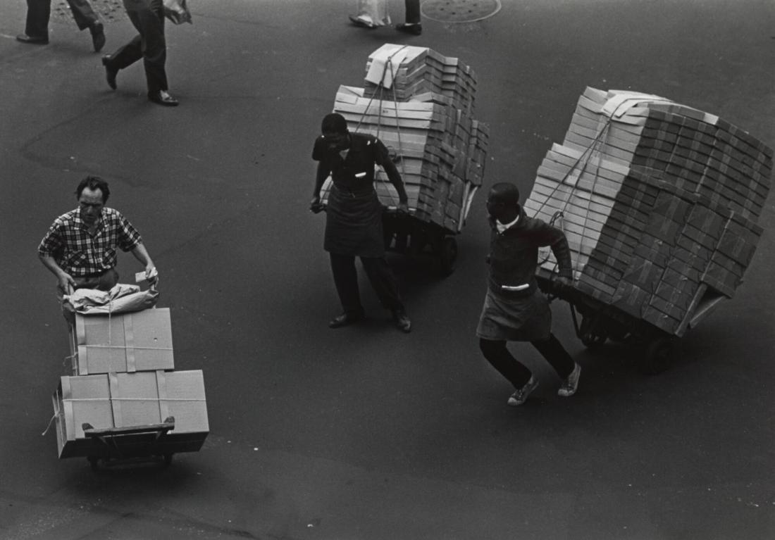 Three Men with Hand Trucks
