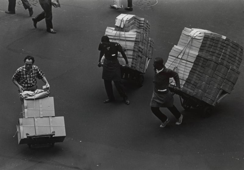 Three Men with Hand Trucks