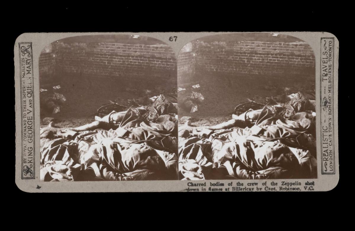 Charred bodies of the crew of the Zeppelin shot down in flames at Billericay by Capt. Robinson, V.C. . From the box The Great War
