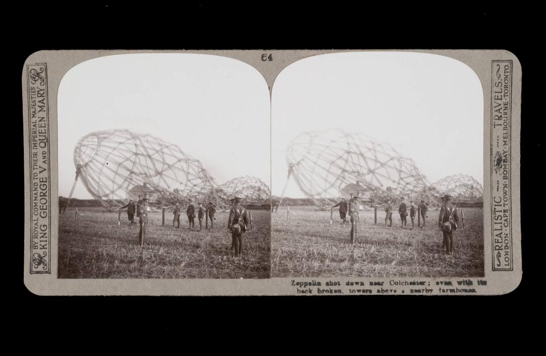 Zeppelin shot down near Colchester; even with the back broken. towers a nearby farmhouse. From the box The Great War
