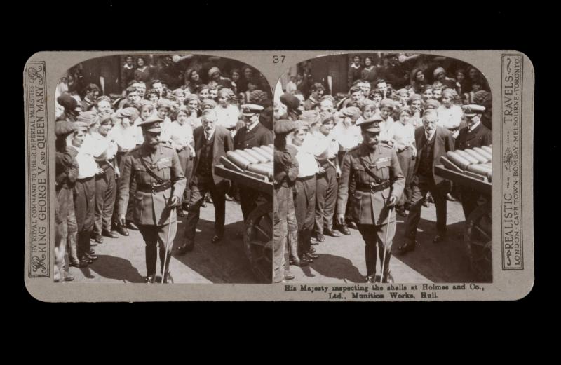 His Majesty inspecting the shells at Holmes and Co., Ltd., Munition Works, Hull. From the box The Great War