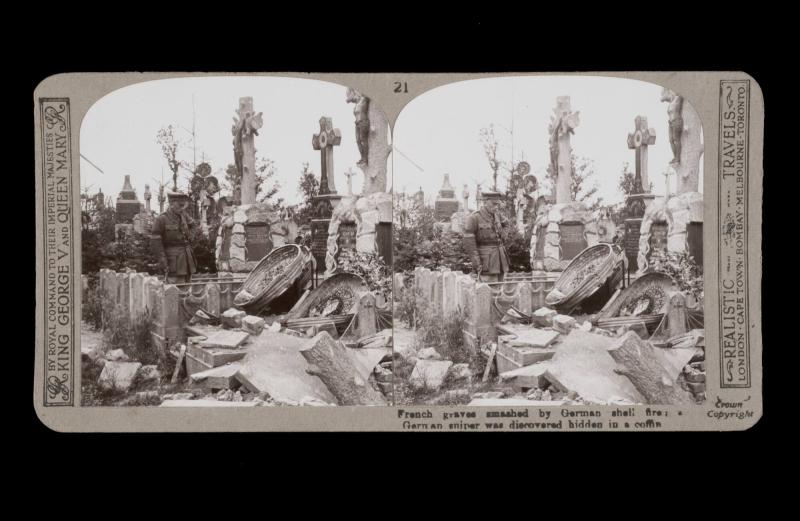 French graves smashed by German shell fire: a German sniper was discovered hidden in a coffin. From the box The Great War