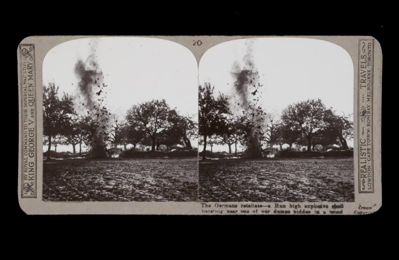 The German retaliate - a Hun high explosive shell bursting near one of our dumps hidden in the wood. From the box The Great War
