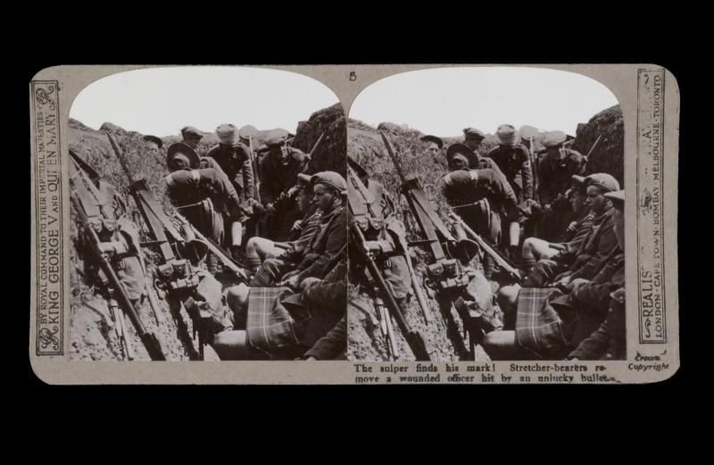 The sniper finds his mark! Stretcher-bearers remove a wounded officer hit by an unlucky bullet. From the box The Great War