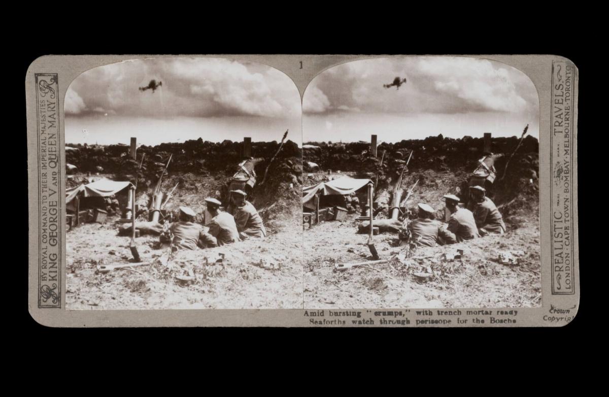 Amid bursting "erumps," with trench mortar ready. Seaforths watch through periscope for the Bosche. From the box The Great War