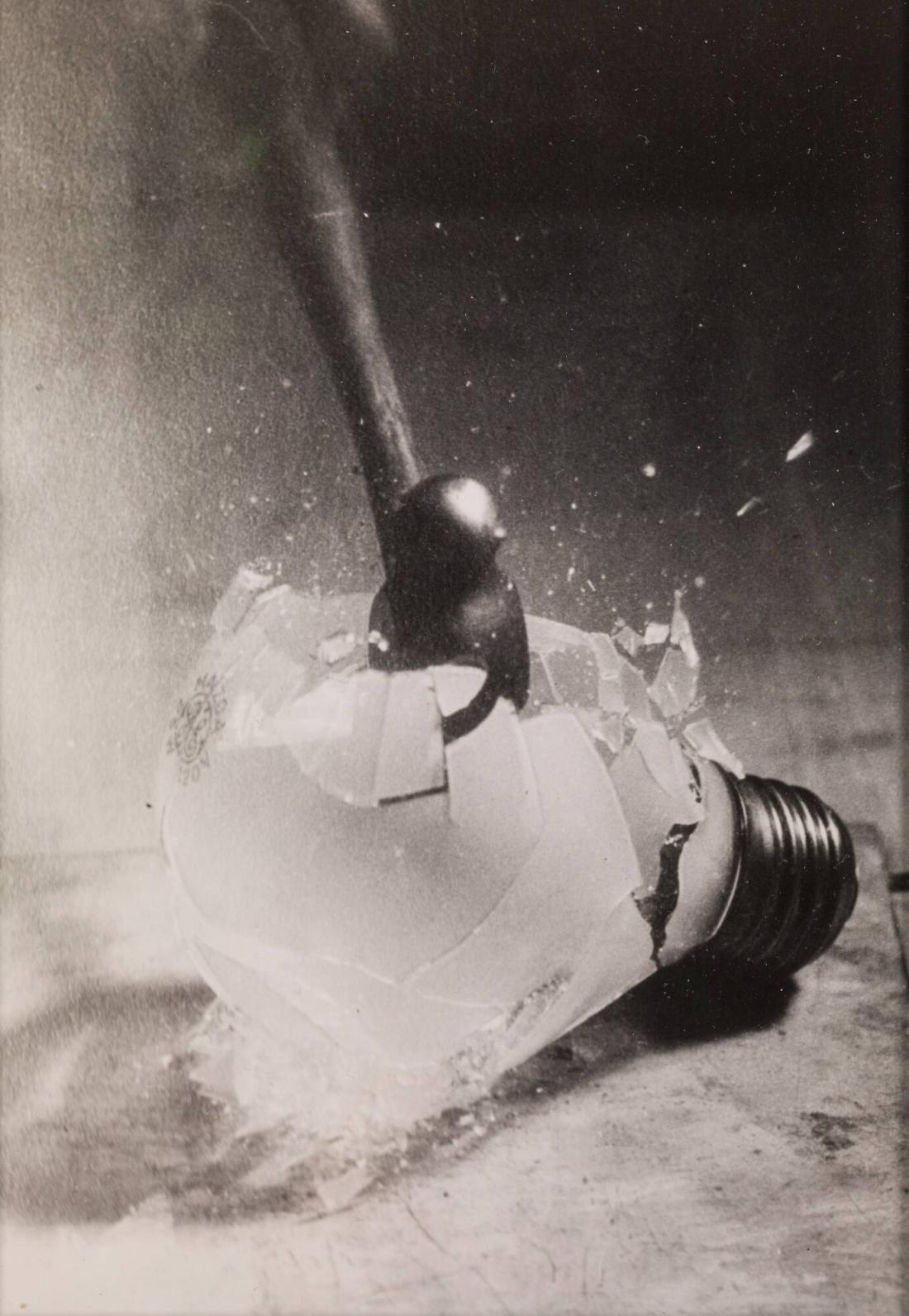 Hammer Smashing an Electric Light Bulb