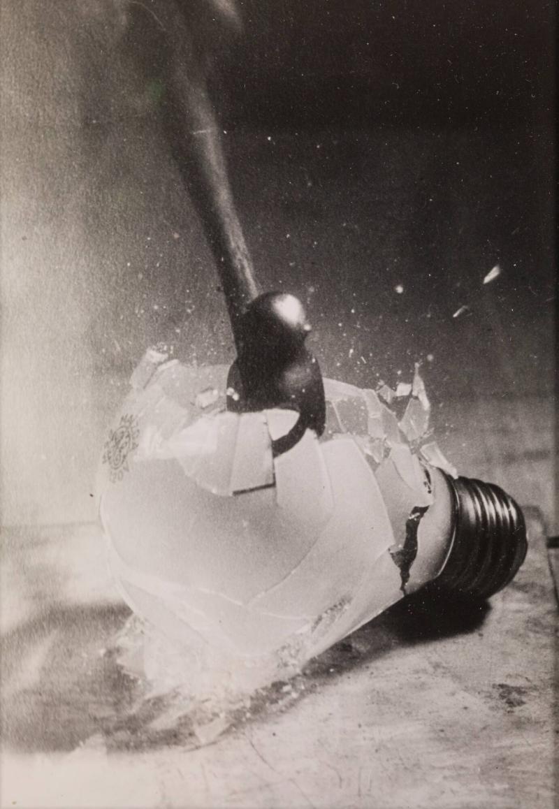 Hammer Smashing an Electric Light Bulb