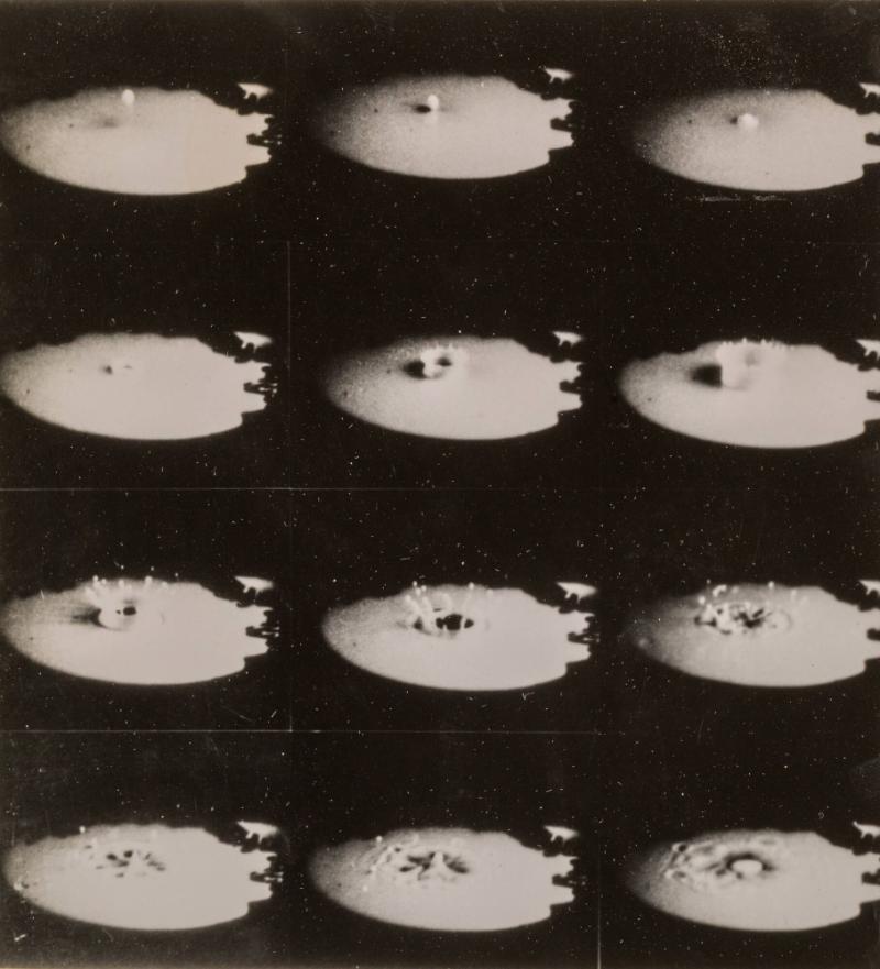 The Splash of a Drop of Milk on a Plate Covered by a Thin Layer of Milk