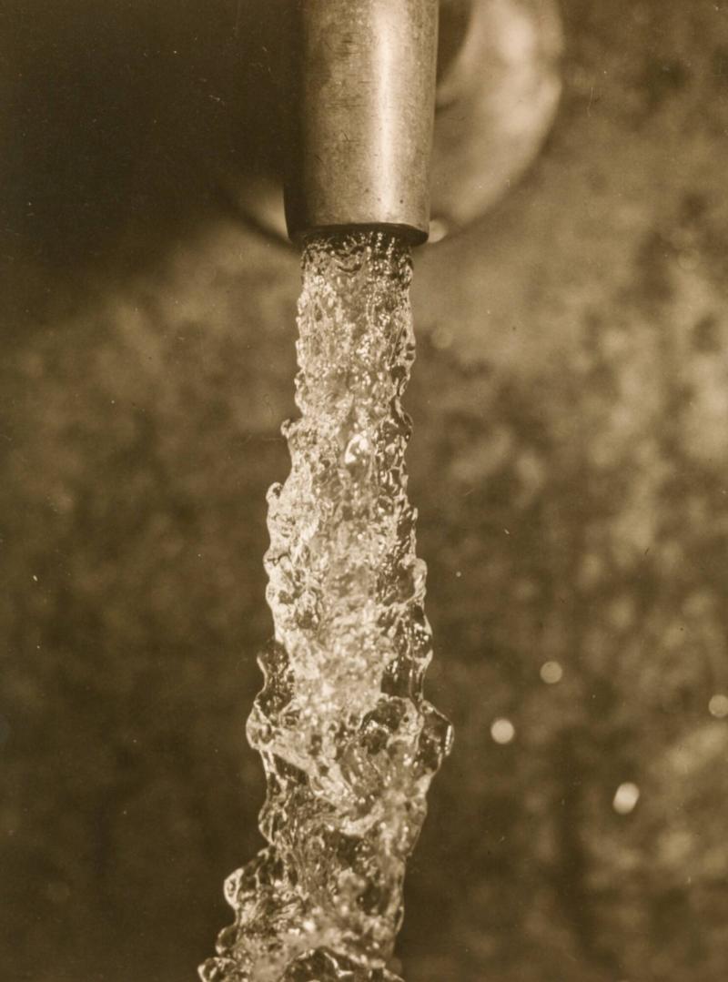 Water flowing out of a faucet